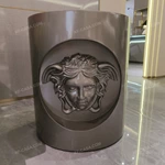 Sculptural Cylindrical Sofa Side Table with Brushed Stainless Steel Body and Raised Classical Face Relief